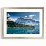 Textured art print of British Columbia scenery in muted green and blue, framed in silver, suitable for bedroom decor.