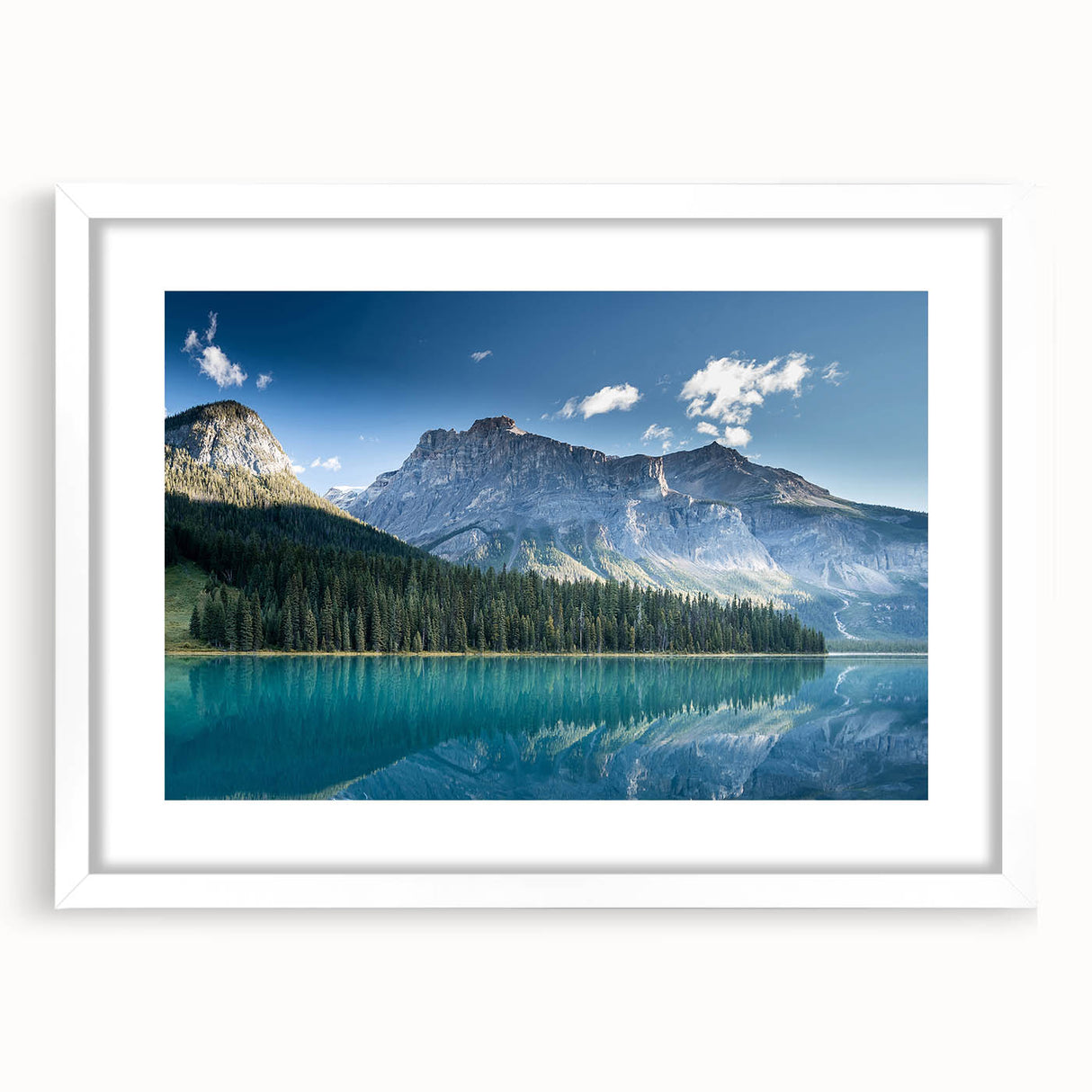 Abstract art print of British Columbia scenery in muted greens and blues, framed with a white mat.