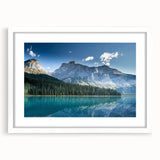 Abstract art print of British Columbia scenery in muted greens and blues, framed with a white mat.