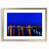 Textured art print of abstract scenery in shades of blue and gray, framed in silver, ideal for bedroom wall decor.