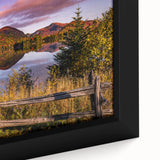 Close-up of textured black wall art depicting a colorful Quebec scenery on a framed canvas.