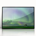 Large abstract wall art of Saskatchewan scenery in muted green and blue hues, framed in black acrylic.
