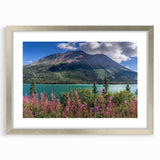 Textured abstract art print depicting Yukon scenery in muted earth tones, framed in silver, suitable for bedroom decor.