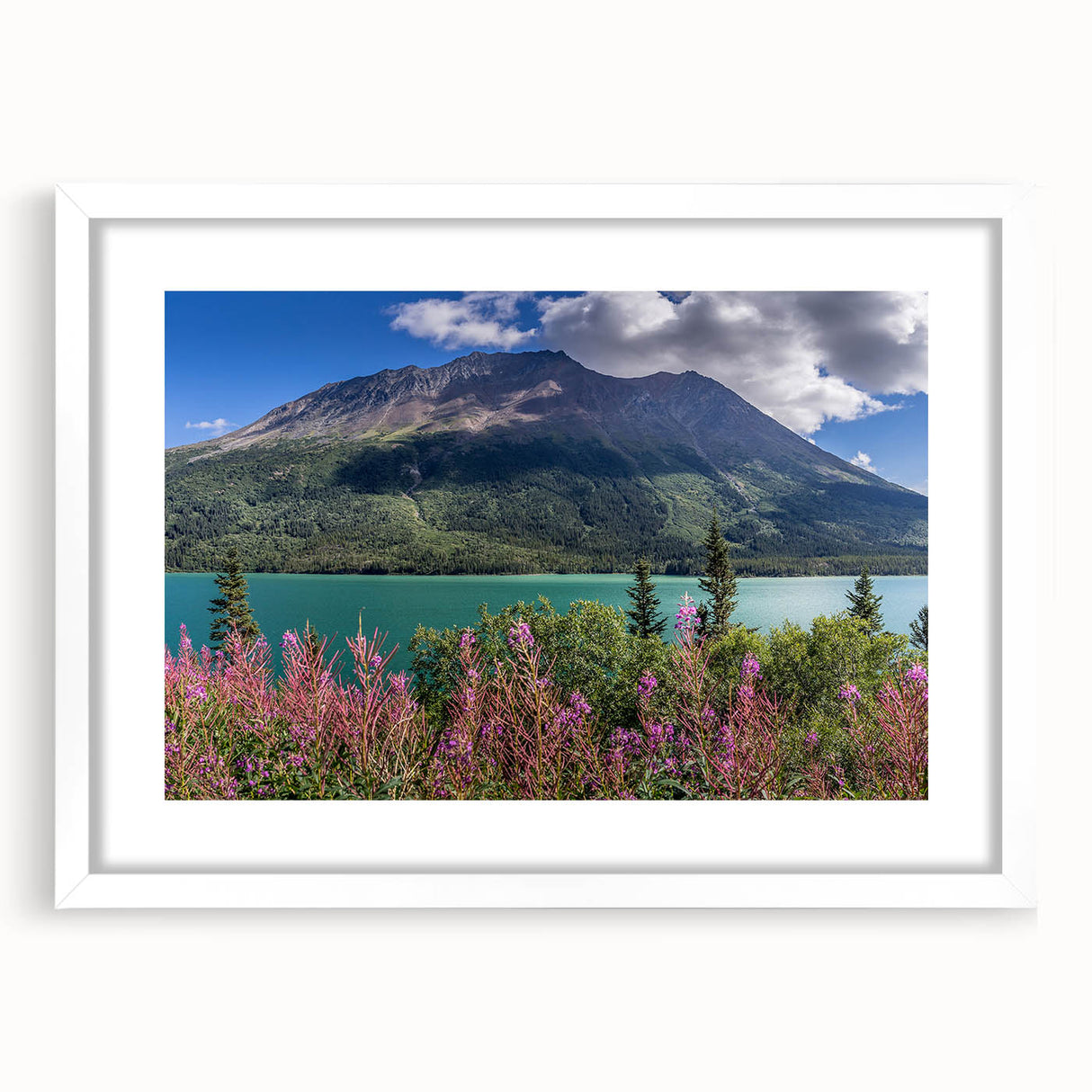 Abstract art print of Yukon scenery in muted green and blue tones, framed with a white mat, ideal for dining room decor.