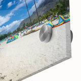 Large abstract wall art of a Caribbean scenery in muted blue and green tones on acrylic glass.