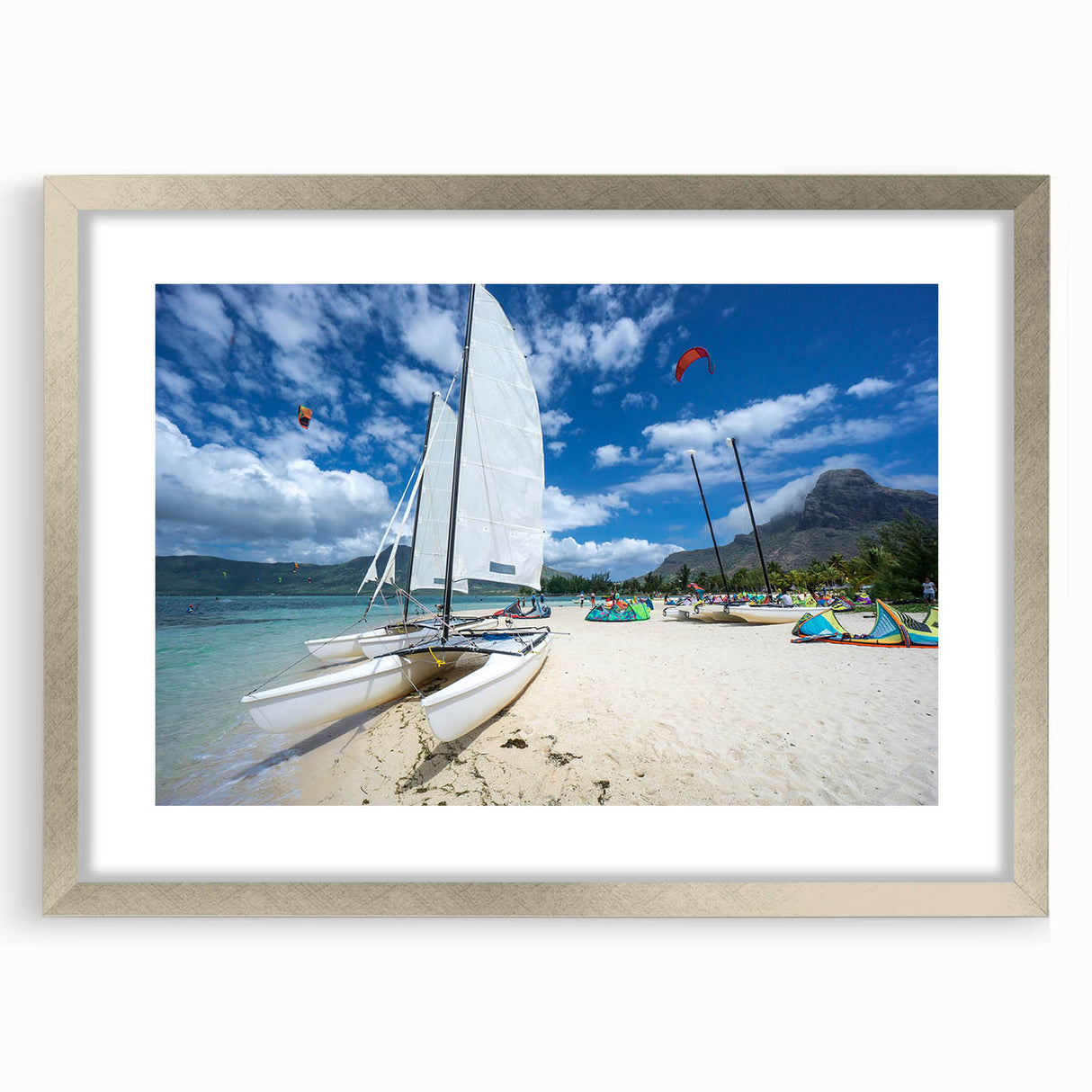 Extra large wall art featuring an abstract Caribbean scenery in textured blues and greens, framed in silver.