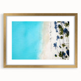 Abstract art print featuring a Caribbean seascape in blue and turquoise tones, framed in gold.