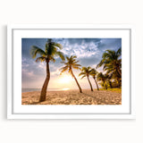 Textured abstract art print of a Caribbean scenery in muted blue and green tones, framed in white, ideal for bedroom decor.