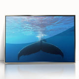 Large art print of a Caribbean scenery in muted blue and green tones, acrylic print in a silver frame.