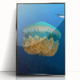 Large art print of a Caribbean scenery in muted blue and green tones on a silver-framed acrylic.