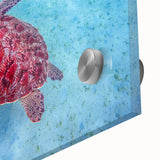 Large abstract wall art of a Caribbean scenery in muted blue and green tones on acrylic glass.