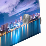 Large abstract wall art of a Caribbean scene in vibrant blue and green hues on acrylic glass.