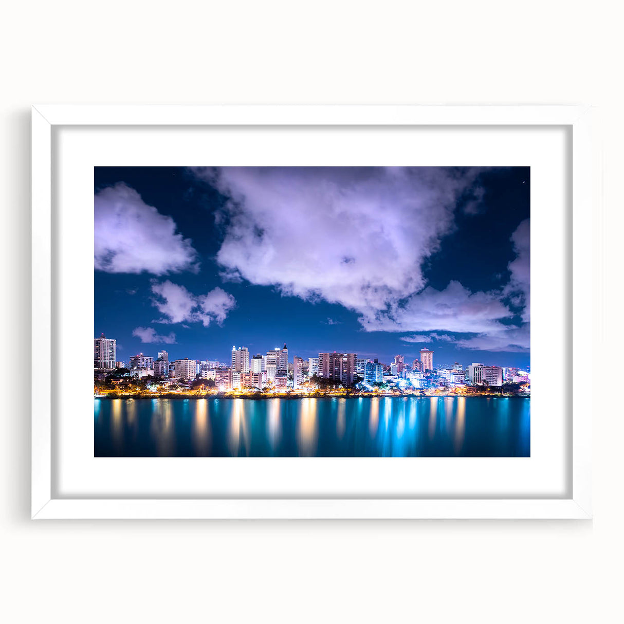Textured abstract art print of a Caribbean scenery in muted blue and green, framed in white, ideal for bedroom art.