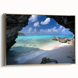Framed canvas featuring a vintage-style Caribbean landscape with lush greenery and ocean views, set in a gold frame.