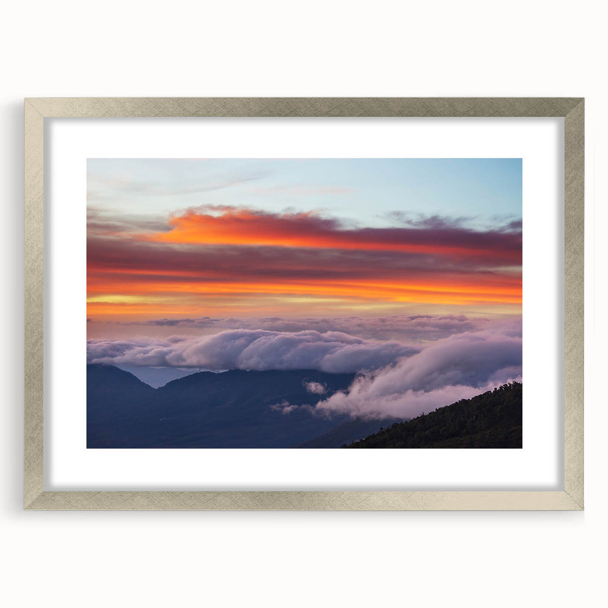 Textured abstract art print of a Central American scenery in muted earth tones, framed with a silver mat.