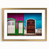 Abstract art print of a Central American landscape in textured, earthy tones on a large canvas, framed in gold.