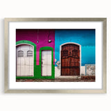 Textured abstract art print of Central American scenery in muted earth tones on a silver framed mat.