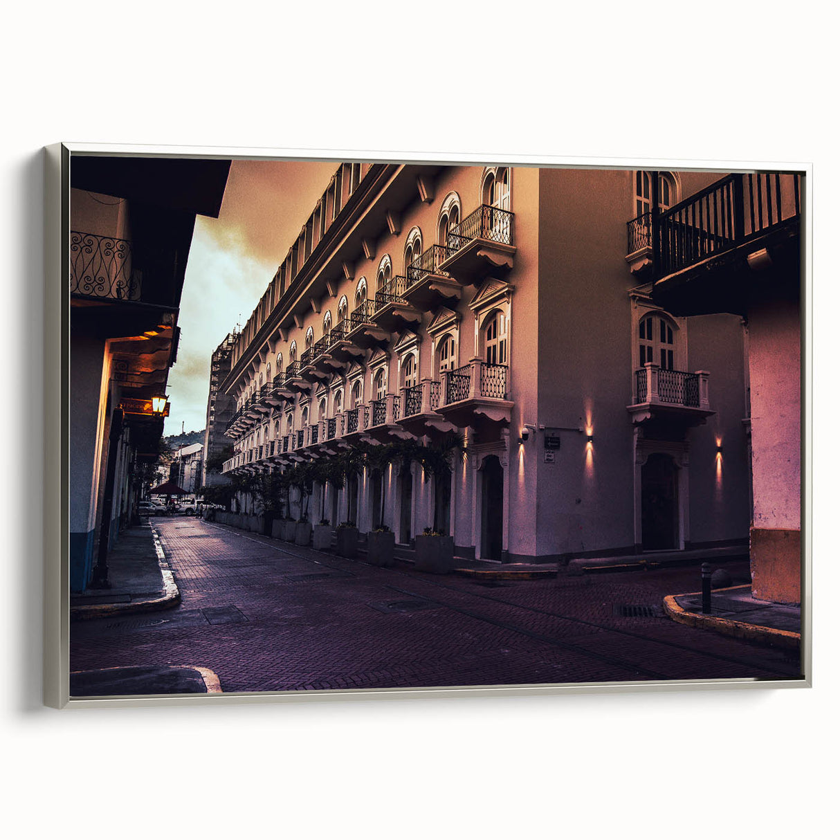 Framed canvas featuring a vintage-style landscape painting of Central America with vibrant colors on a black background.