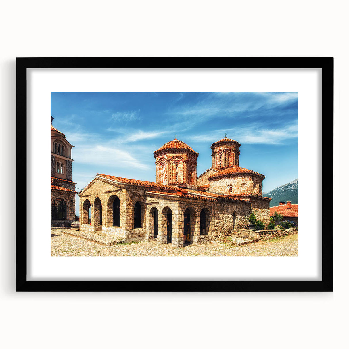 Extra large abstract art print depicting a colorful, textured European scenery on a framed black mat.