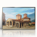 Large art print of a serene Albanian landscape in muted earth tones on a silver-framed acrylic.