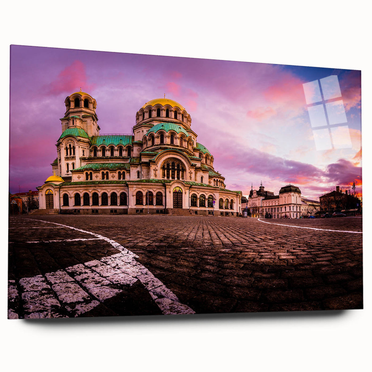 Large abstract wall art of a European scenery in vibrant blue and green hues on acrylic glass.
