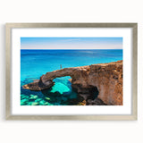 Extra large abstract art print of a textured European scenery in muted earth tones, framed in silver.