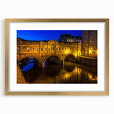 Abstract art print of Bath, England skyline in muted gold and blue tones on a framed canvas, suitable for dining room decor.