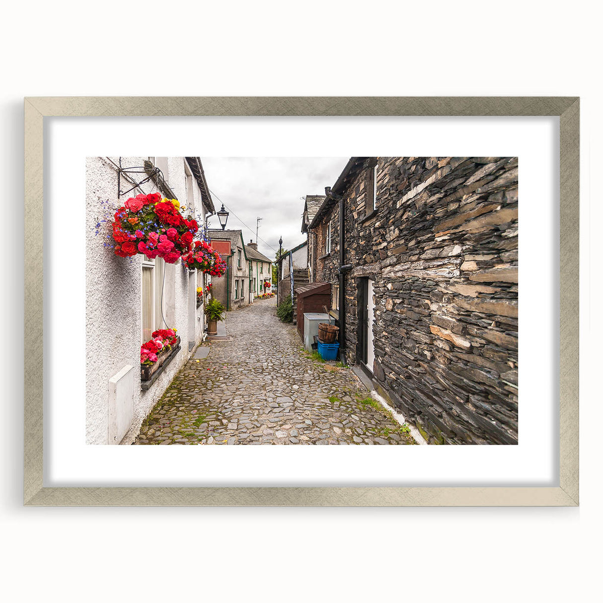 Extra large abstract art print of Cumbria, England, in muted earth tones on a textured canvas, framed in silver.