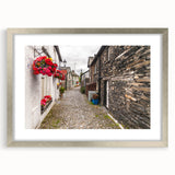Extra large abstract art print of Cumbria, England, in muted earth tones on a textured canvas, framed in silver.