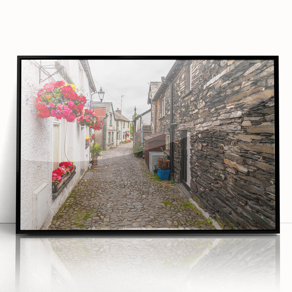 Large abstract wall art depicting a serene Cumbrian landscape in muted green and blue tones, framed in black acrylic.