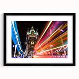 Abstract art print of London skyline in vibrant, colorful hues on a large black-framed canvas, ideal for living room decor.