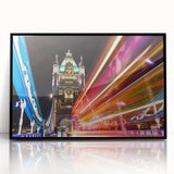 Large abstract wall art of London scenery in muted gray and blue tones, framed in black acrylic.