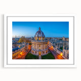 Textured art print of Oxford scenery in abstract style, using muted earth tones on a white framed mat.