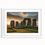 Textured art print of Stonehenge in muted earth tones on a framed white mat, suitable for bedroom wall decor.