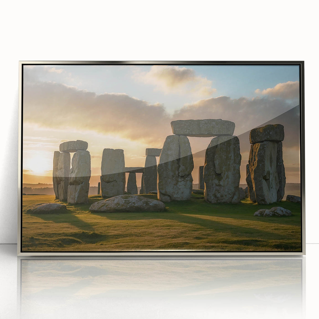 Mid-century modernist art depicting Stonehenge, with muted earth tones, framed in silver acrylic.