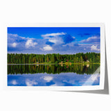 Extra large rolled canvas print featuring a serene Finnish landscape with lush greenery and a tranquil lake.
