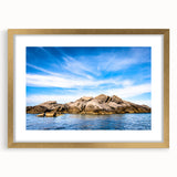 Abstract art print of Corsican landscape in muted earth tones on a gold-framed canvas, suitable for dining room decor.