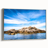 Landscape art painting featuring a vivid scene of Corsica with blues and greens, presented on a silver-framed canvas.