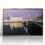 Large art print of Lyon, France in mid-century modernist style, featuring muted earth tones on silver-framed acrylic.