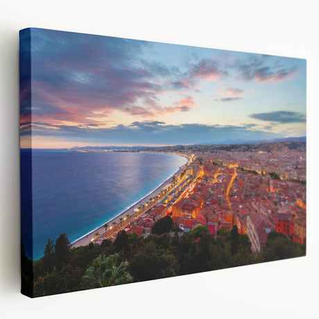Large art print of a scenic Nice, France coastline in muted blue and green hues on stretched canvas.