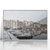 Mid-century modernist acrylic print of Normandy, France, in muted blue and green tones, framed in white.