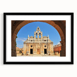 Colorful abstract art print of a European scenery, in vibrant blues and whites on a textured canvas, framed in black.