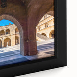 Extra large framed canvas depicting a textured scene of Rhodes, Greece in muted black with colorful highlights.
