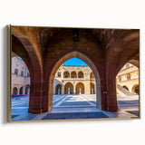 Framed canvas featuring a vintage-style landscape of Rhodes, Greece, in muted gold and black tones, ideal for bedroom decor.