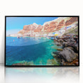 Large abstract wall art depicting the Santorini coastline in muted blue and white tones, framed in black acrylic.