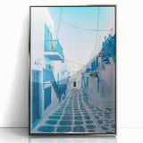 Large art print of a European Greek landscape in muted blues and whites, framed in silver acrylic.