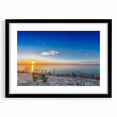 Abstract art print of a colorful European scenery in a black frame, ideal for living room decor.