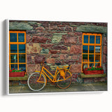 Vintage poster art of a scenic Irish landscape on a framed canvas, featuring vibrant green tones.