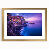 Abstract art print of Cinque Terre with vibrant coastal hues on a gold-framed mat, ideal for dining room decor.