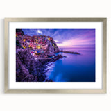 Extra large wall art featuring an abstract print of Cinque Terre in muted pastel shades, framed in silver.